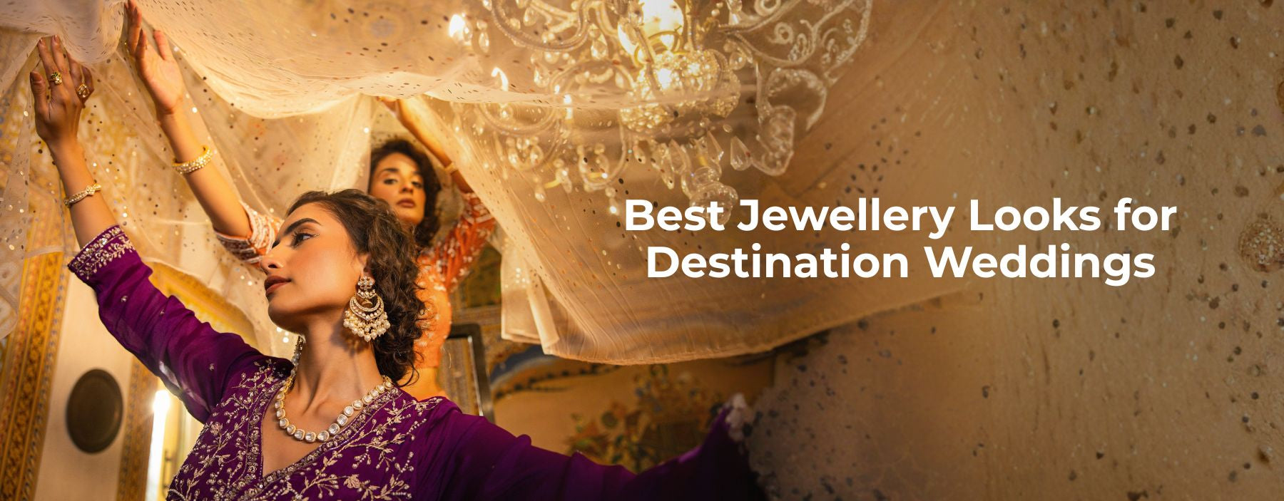 Bride wearing elegant traditional jewellery looks for a destination wedding celebration in a festive setting.