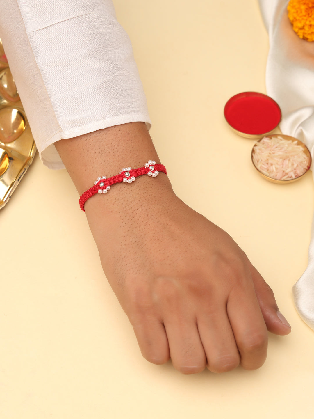 925 Sterling Silver Floral Pearl Rakhi in Red Macramé Thread – Rhodium Plated
