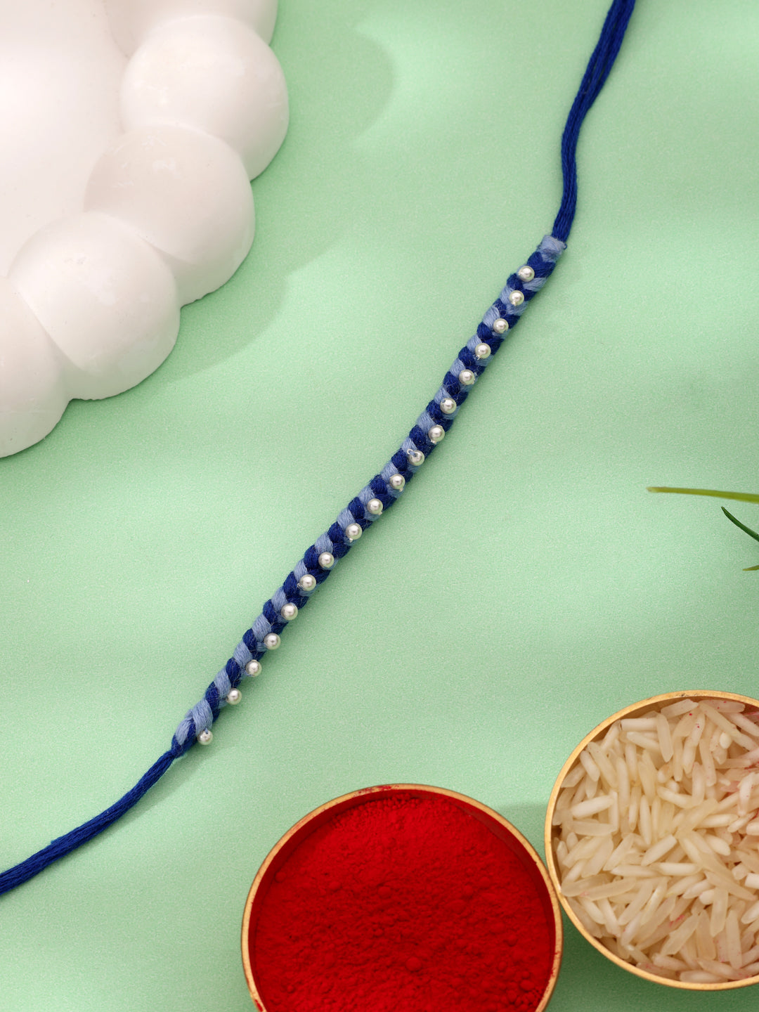 Handcrafted Dual-Tone Blue Braided Kids Rakhi with Pearl Accents