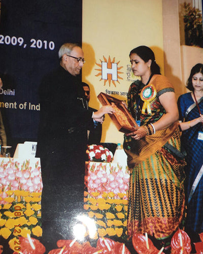 Honoured with a National Award for her mastery of the Kachni line and her monumental canvases.