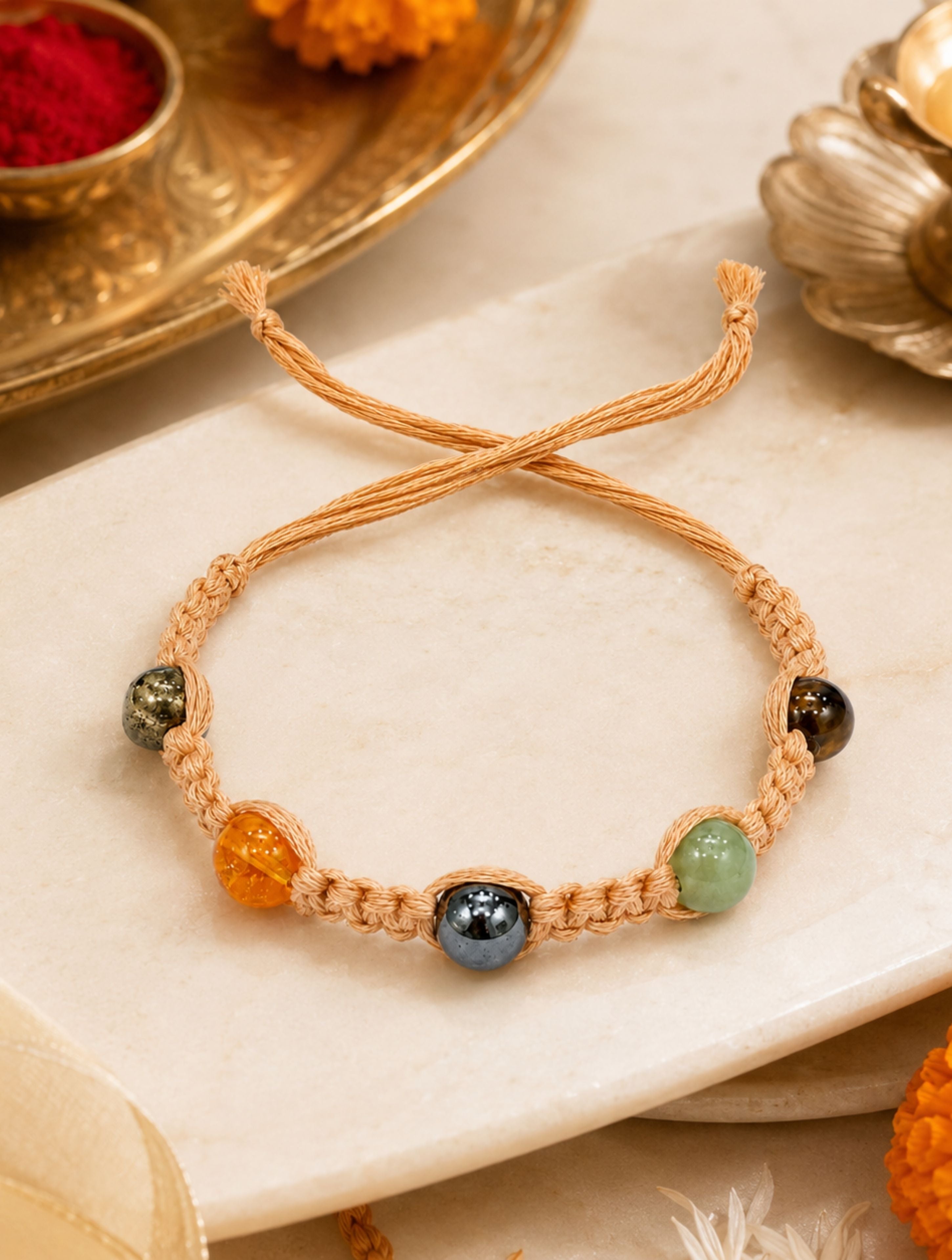 Handcrafted 5-Gemstone Macrame Rakhi | Aventurine, Hematite, Tiger’s Eye, Citrine & Pyrite